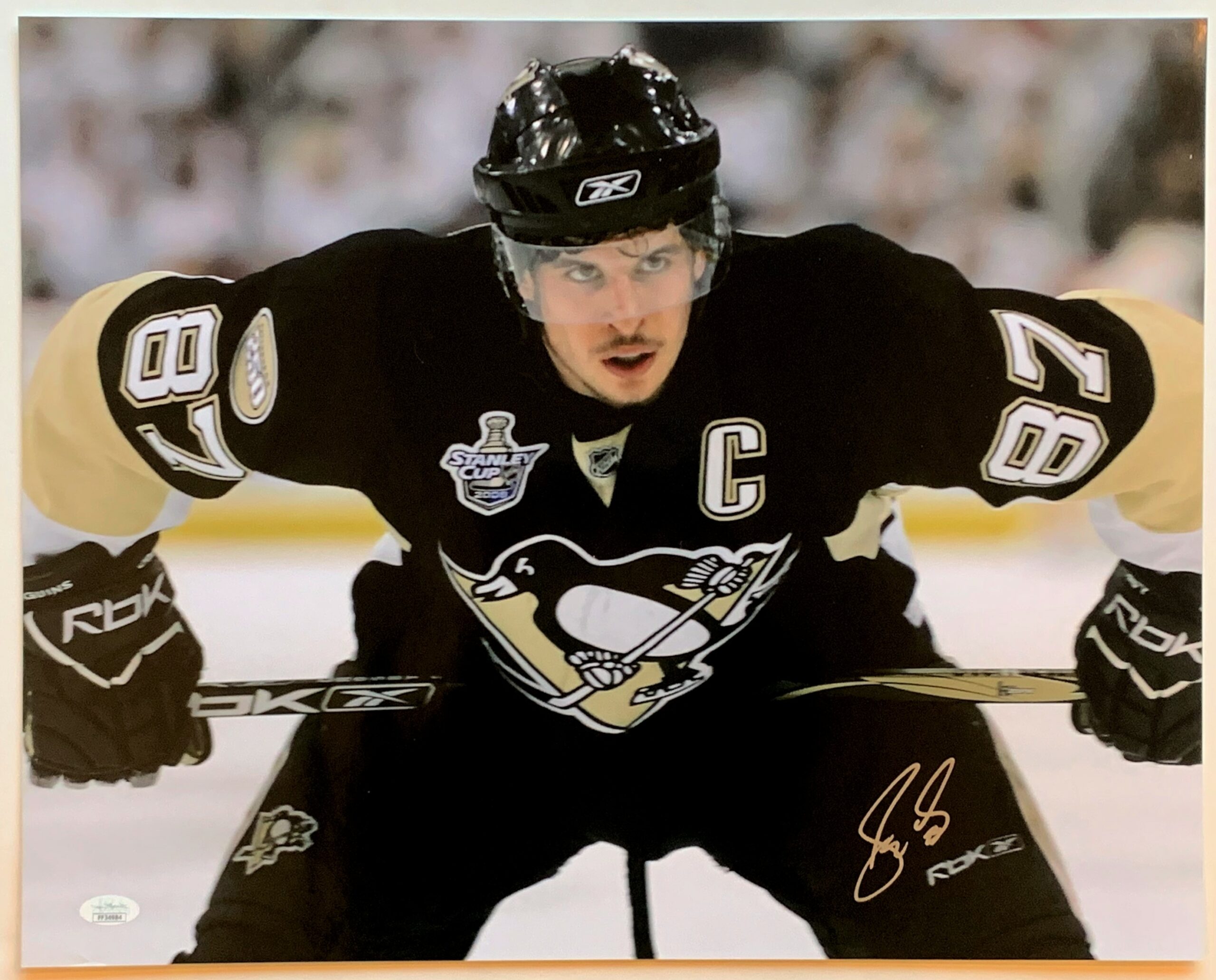 Sidney Crosby of the Pittsburgh Penguins signed